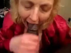 My big dark dick is sucked by a lewd white mother.